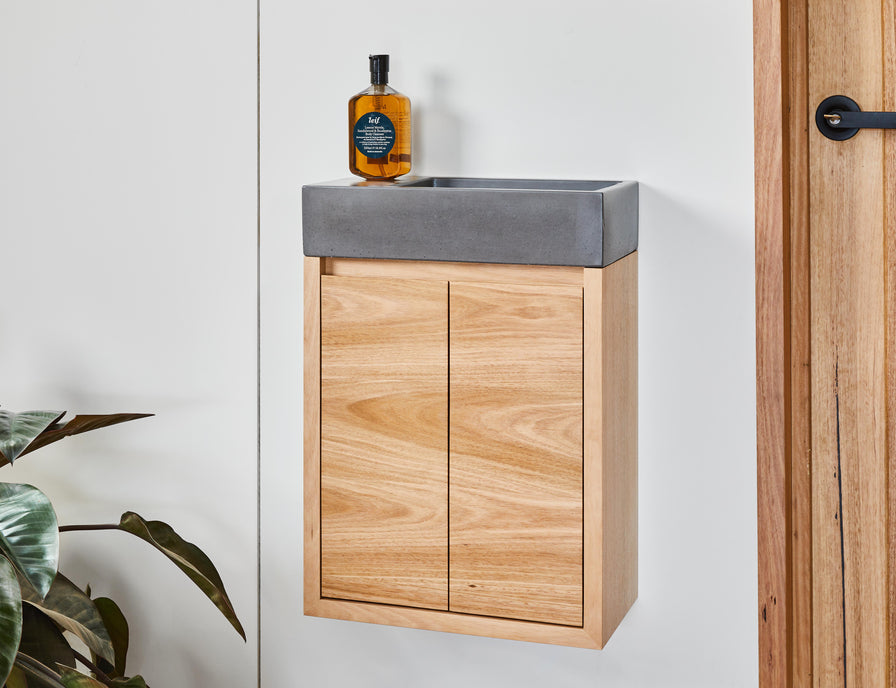All in one timber powder room vanity and concrete basin
