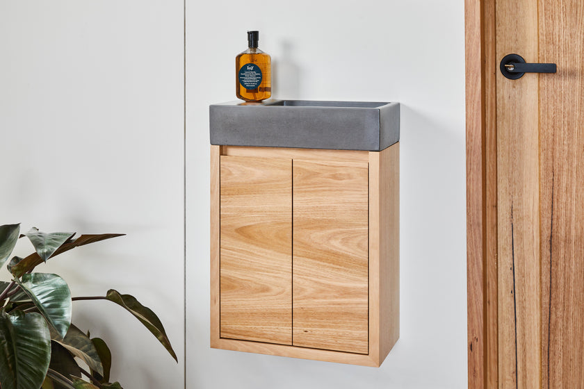 All in one timber powder room vanity and concrete basin
