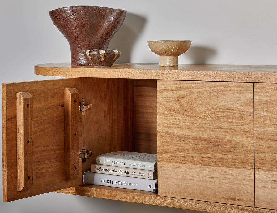 Custom made wall hung wooden TV cabinet with curved ends