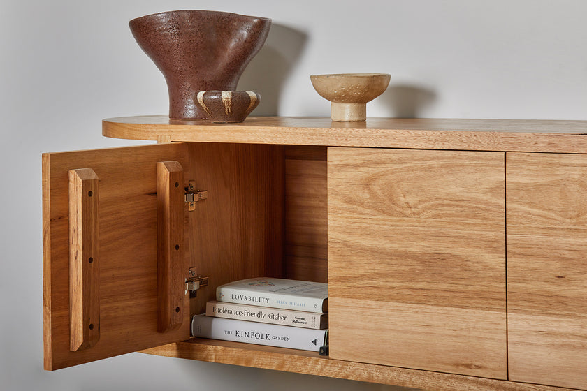 Custom made wall hung wooden TV cabinet with curved ends