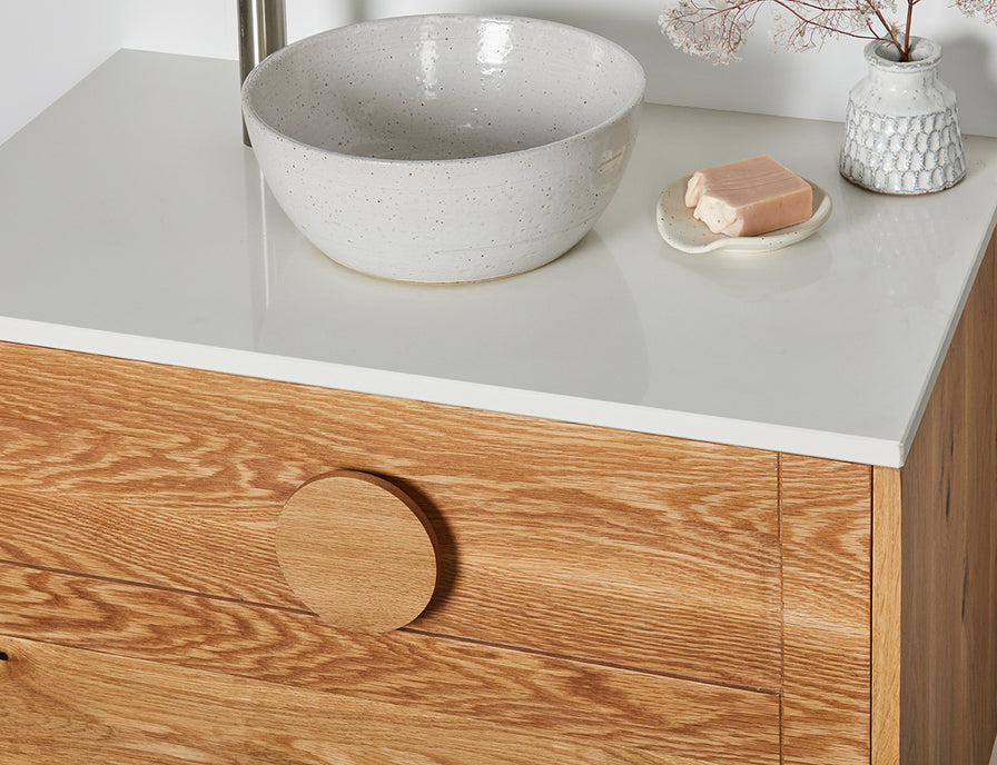 Made to order timber vanity with a round handle and stone top 