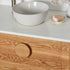 Made to order timber vanity with a round handle and stone top 