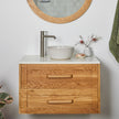 Timber bathroom vanity with shaker style drawers, handles and white stone top
