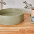 Sage green round concrte basin