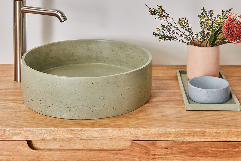 Sage green round concrte basin