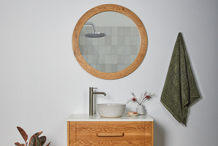 American Oak timber circular mirror in bathroom