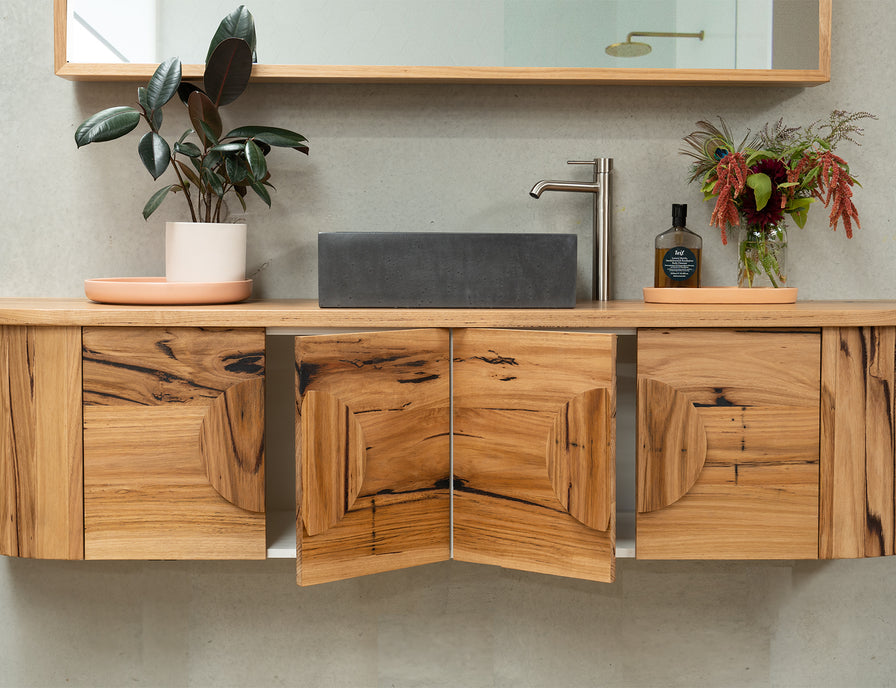 Recycled wood vankty with curved ends and cupboards