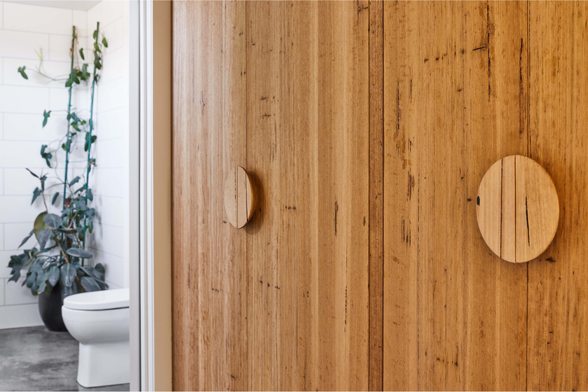 Half moon wood handles on timber wardrobe doors