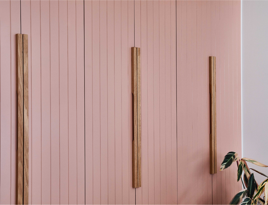 hand made wooden linear cabinetry handle