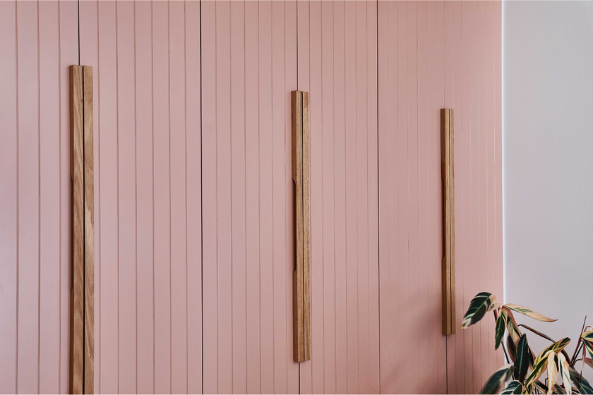 hand made wooden linear cabinetry handle