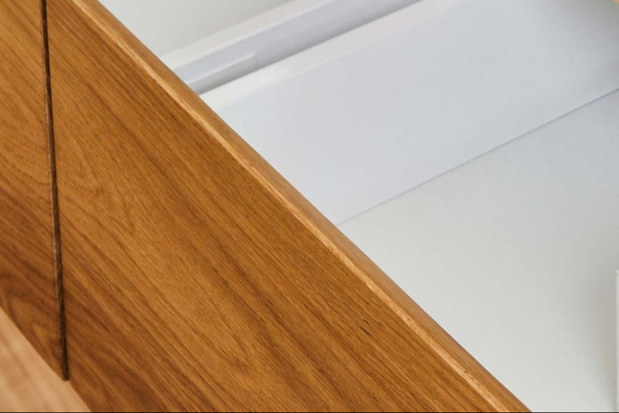 Wooden TV cabinet with white drawers internals