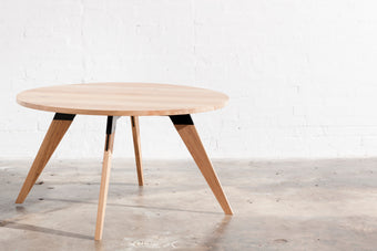 Made to order round timber dining table with black metal