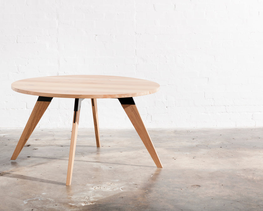 Made to order round timber dining table with black metal