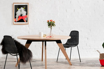 Made to order round table with black metal accents