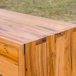 Made to order recycled timber TV cabinet with black legs and markings