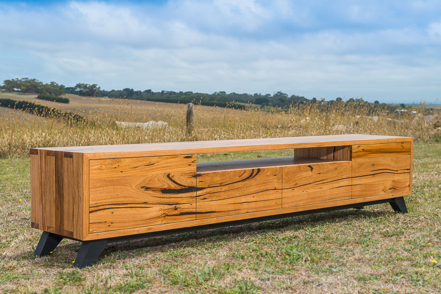 Timber Frame Tv Custom made TV unit created from solid timber and angled black legs