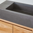 dark grey concret basin on small powder room vanity