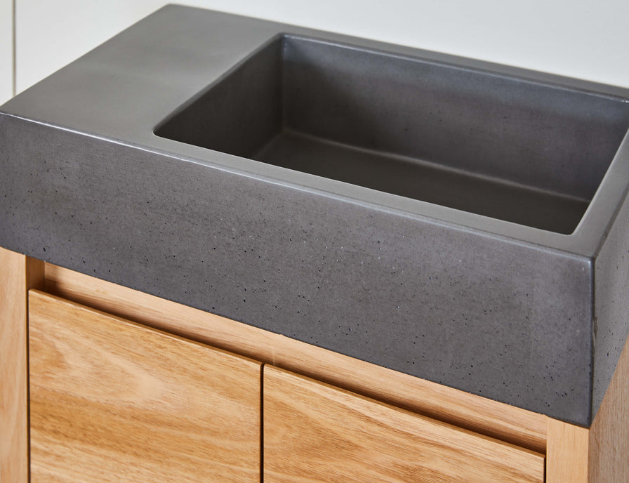 dark grey concret basin on small powder room vanity