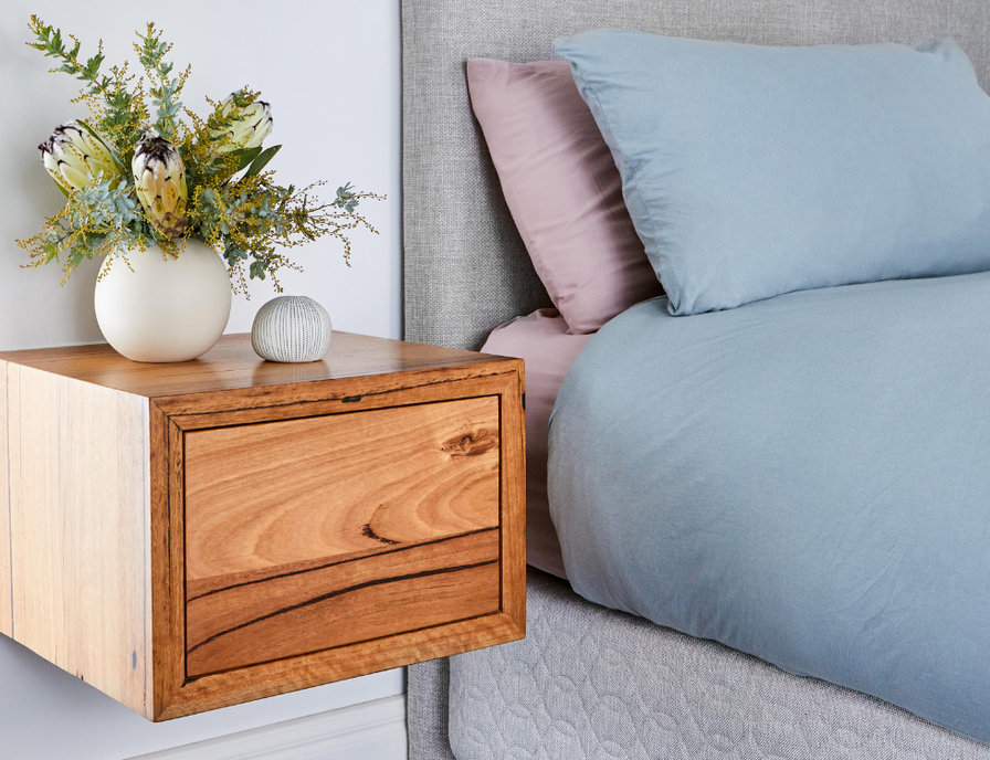 Wall mounted wooden bedside cabinet in Messmate timber