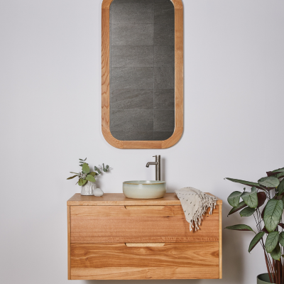 rectangular timber framed mirror in bathroom with a timber vanity