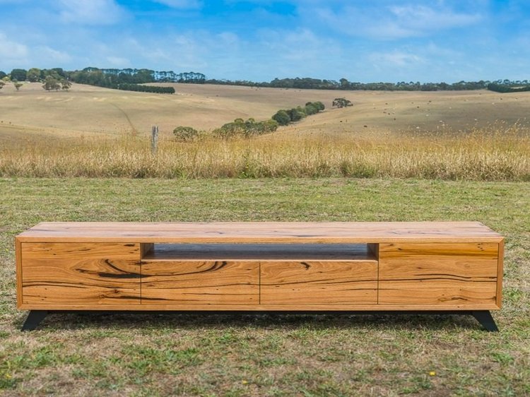 Custom made TV unit created from solid timber and angled black legs